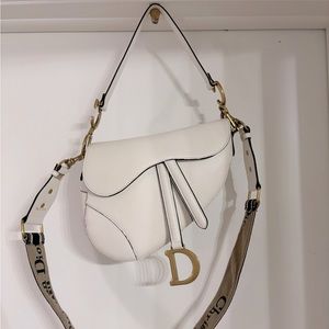 Used Christian Dior white saddle bag